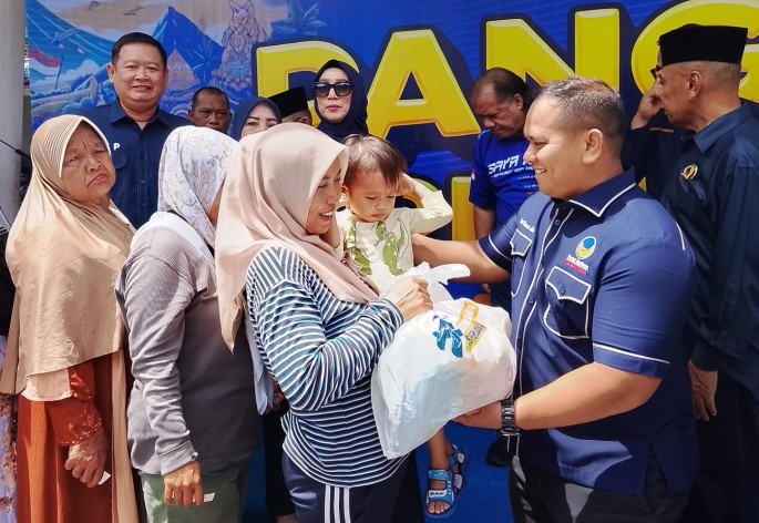 Rayakan HUT ke-14, NasDem Riau menggelar aksi sosial dan lomba meriah (foto/ist)