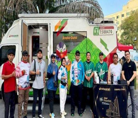 BRK Syariah turut berpartisipasi dalam memeriahkan peringatan HUT ke-1 Komjaki Riau yang digelar di GOR Tribuana, Pekanbaru, Minggu (15/6/2025)..