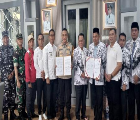 PGRI Rohil adakan MoU bersama Polres Rohil (foto/afrizal)